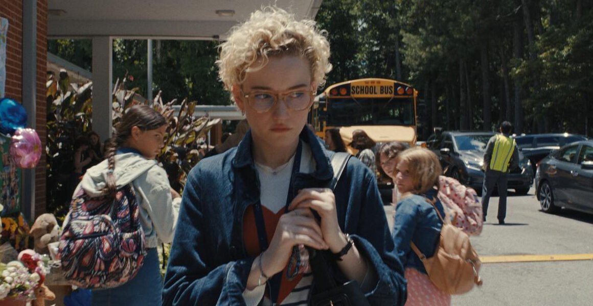 Children looking at Julia Garner as she walks towards her car looking over her shoulder in Weapons | Agents of Fandom