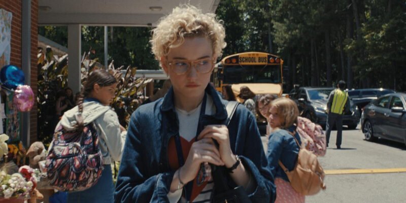 Children looking at Julia Garner as she walks towards her car looking over her shoulder in Weapons | Agents of Fandom