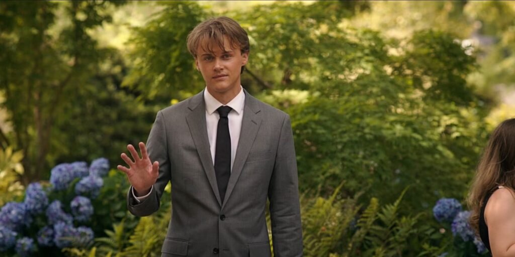 Conrad (Christopher Briney) looks dazed as he awkwardly waves to Belly, offscreen in TSITP Season 3 Episode 3 | Agents of Fandom