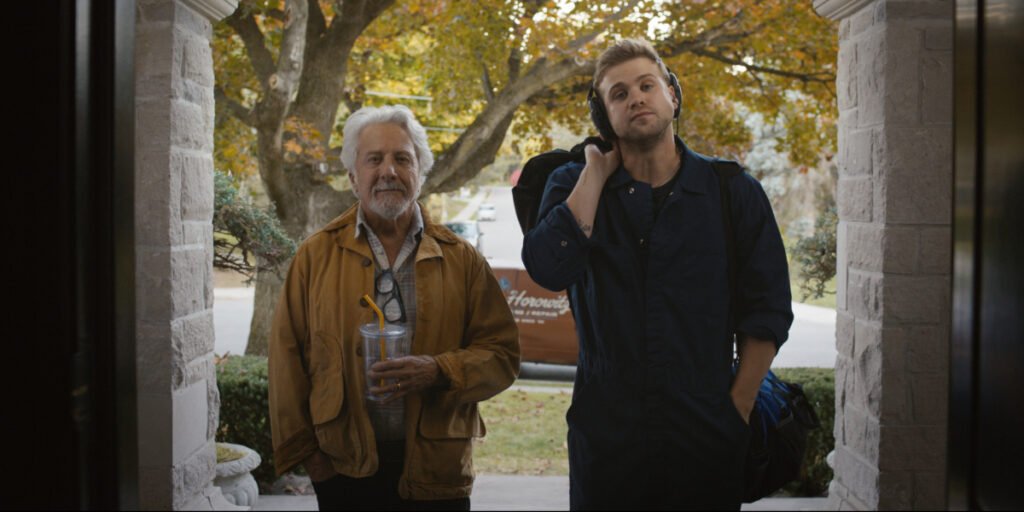 Dustin Hoffman and Leo Woodall standing outside a doorway in Tuner | Agents of Fandom