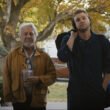 Dustin Hoffman and Leo Woodall standing outside a doorway in Tuner | Agents of Fandom