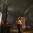 Victor Frankenstein (Oscar Isaac) staring up at his creation, The Creature (Jacob Elordi) in a giant lab in Guillermo del Toro's Frankenstein | Agents of Fandom