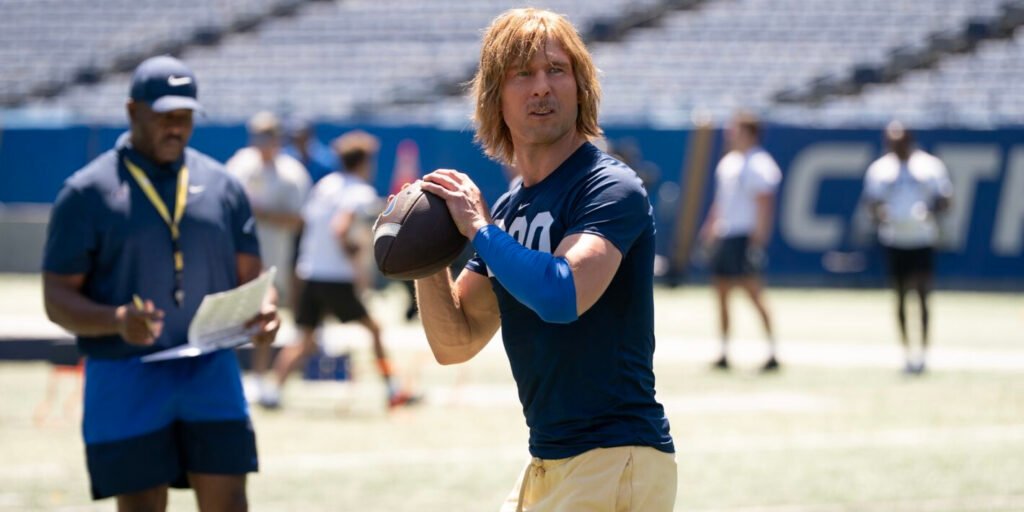 Glen Powell throwing a football as Chad Powers | Agents of Fandom