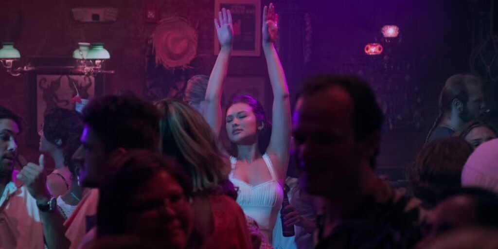 Amidst a crowd, Belly dances with her hands up for her bachelorette party | Agents of Fandom