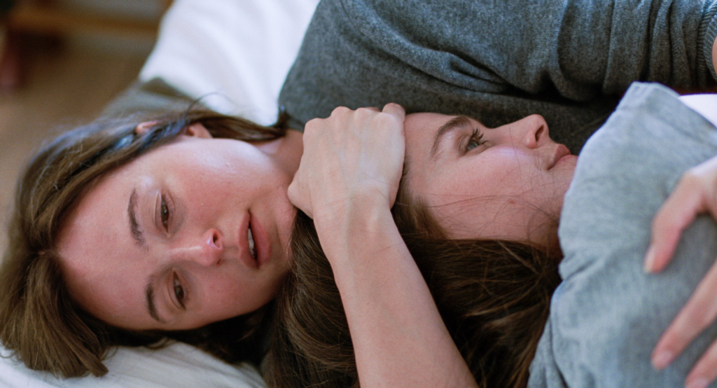 Nora (Renate Reinsve) holds her sister Agnes in a moment of catharsis in Sentimental Value | Agents of Fandom