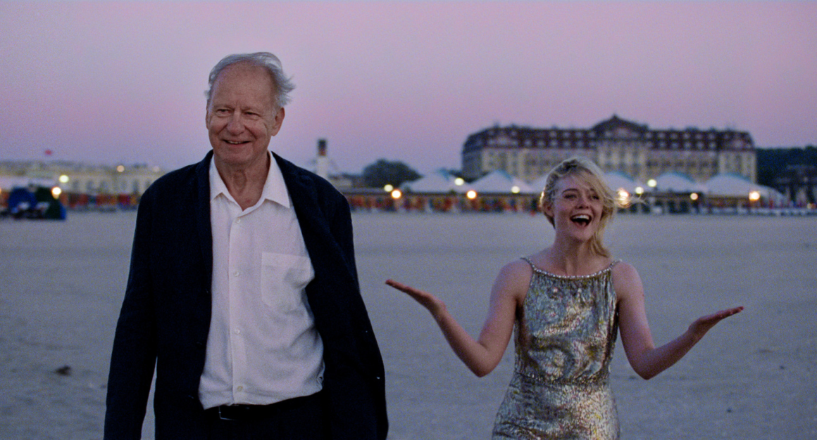 Gustav (Stellan Skarsgård, left) and Rachel Kemp (Elle Fanning, right) experience a magical meeting during an international film festival in Sentimental Value | Agents of Fandom