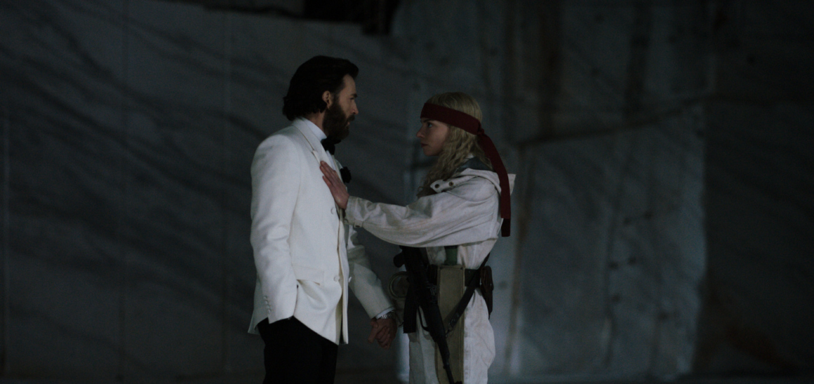 Anya Taylor-Joy holds her arm on Chris Evans' chest as they hold hands and stare into each others' eyes in 'Sacrifice' | Agents of Fandom