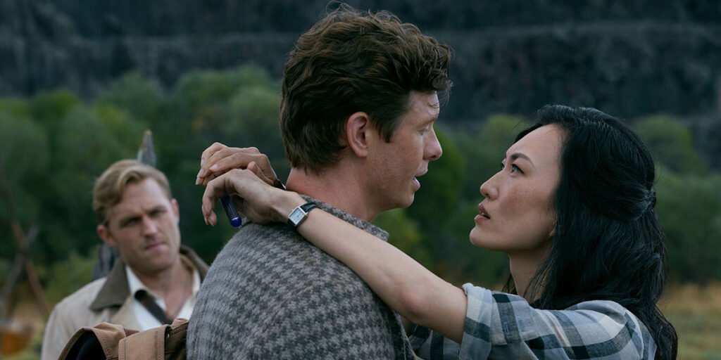 Dr. Keiko Miura (Mari Yamamoto), and young Bill Randa (Anders Holm) embrace in Monarch: Legacy of Monsters Season 2 | Agents of Fandom