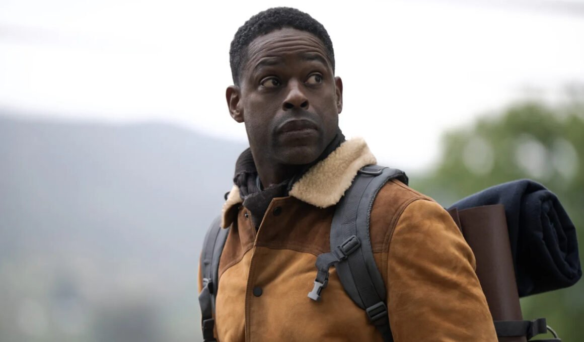 Xavier Collins (Sterling K. Brown) staring off into the distance while carrying a bag of gear in Paradise Season 2 | Agents of Fandom