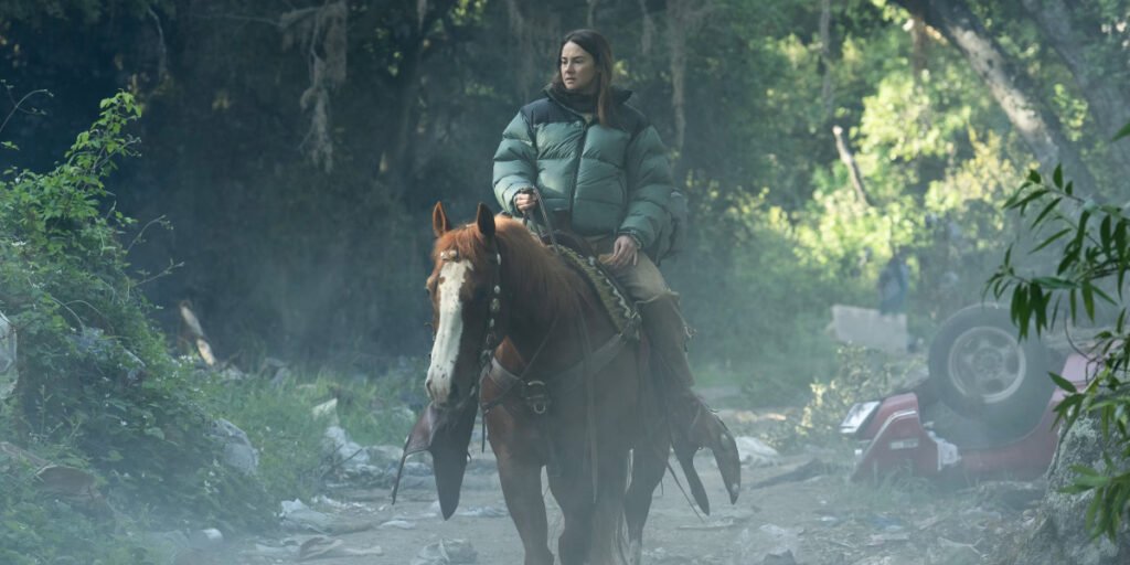 Annie (Shailene Woodley) riding a horse with destroyed vehicles and greenery surrounding her in Paradise Season 2 | Agents of Fandom
