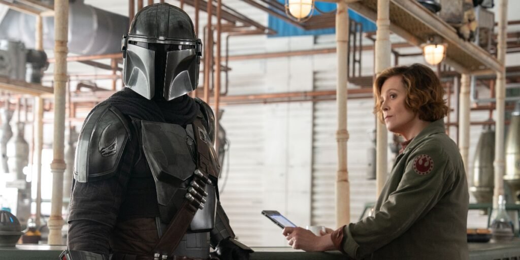 Pedro Pascal and Sigourney Weaver star in The Mandalorian and Grogu | Agents of Fandom